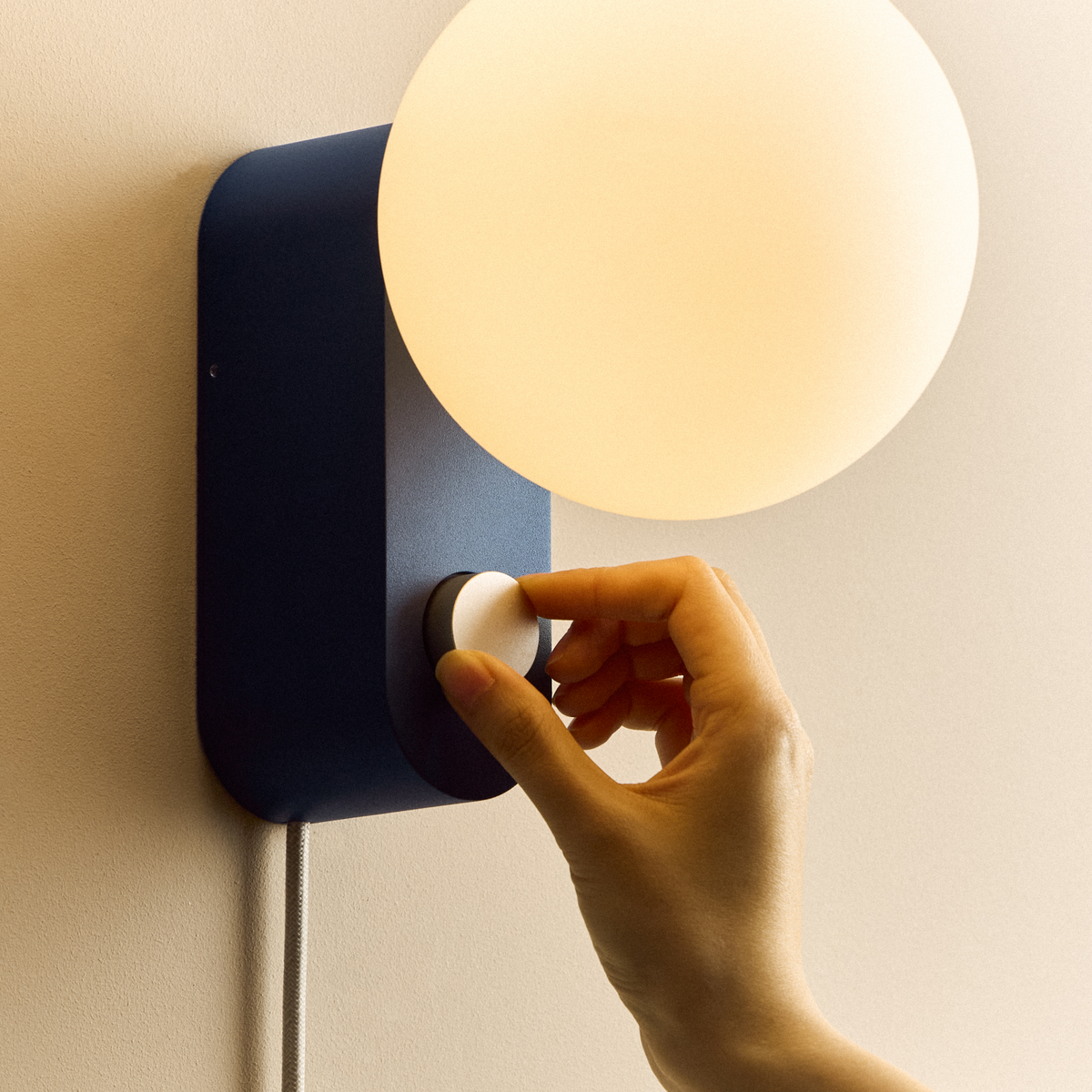 Alumina Lamp in Sapphire mounted on a wall, close-up