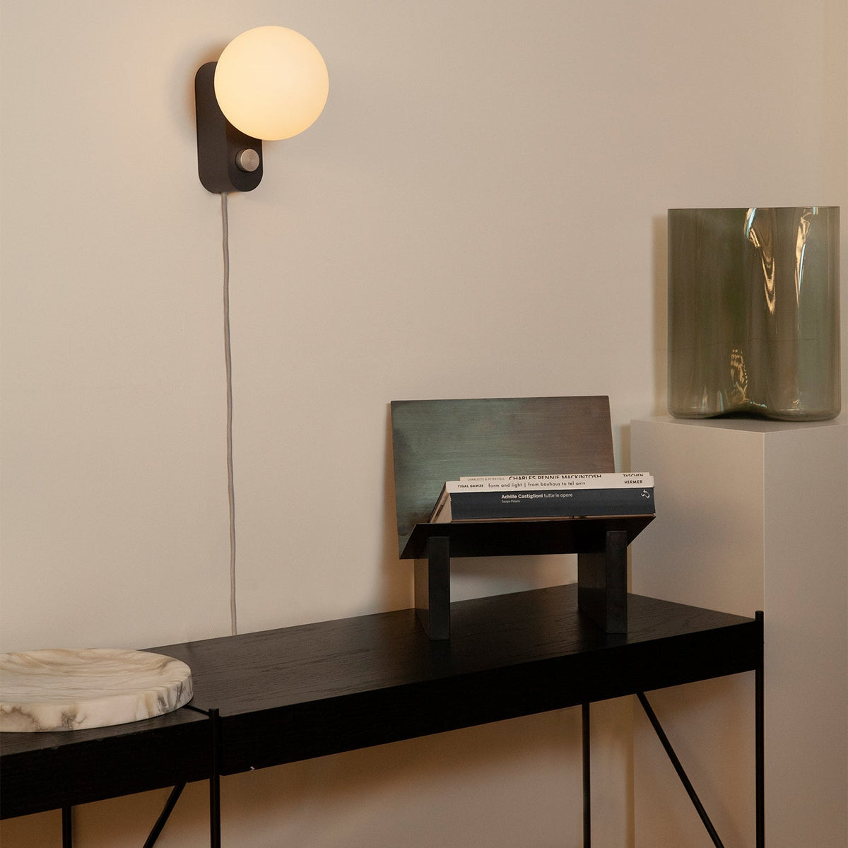 Alumina Lamp in Charcoal mounted on a wall