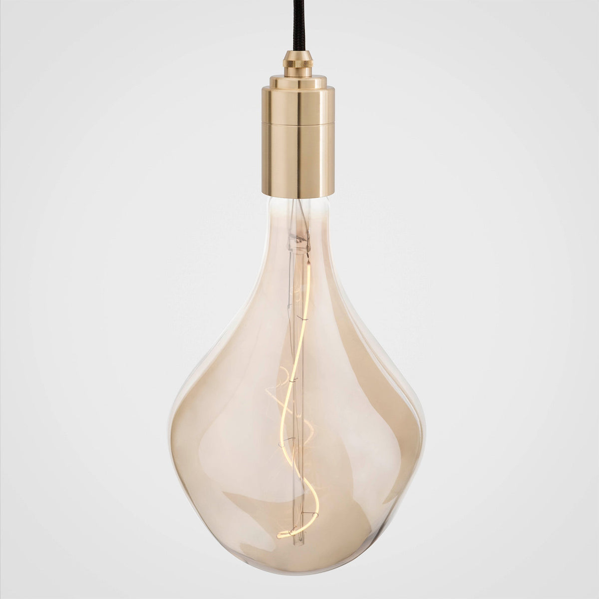 Voronoi II bulb in a brass lampholder, switched on