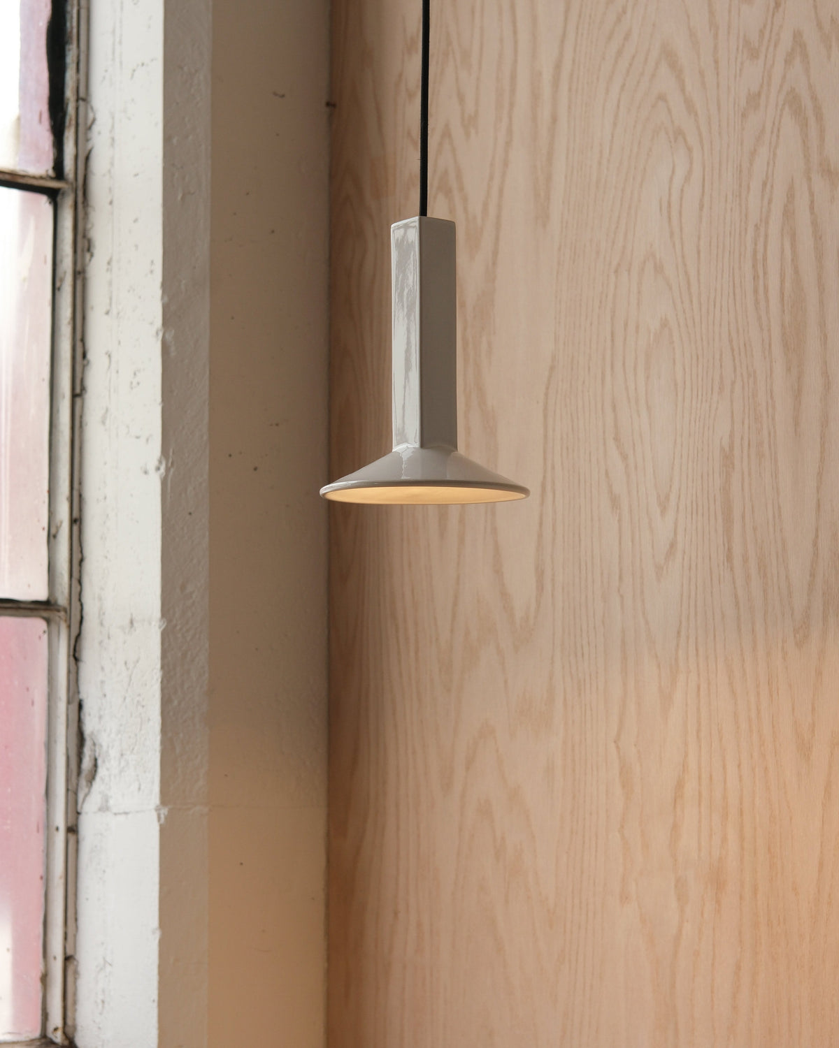 Arthur Pendant in White Glossy, lit, room setting