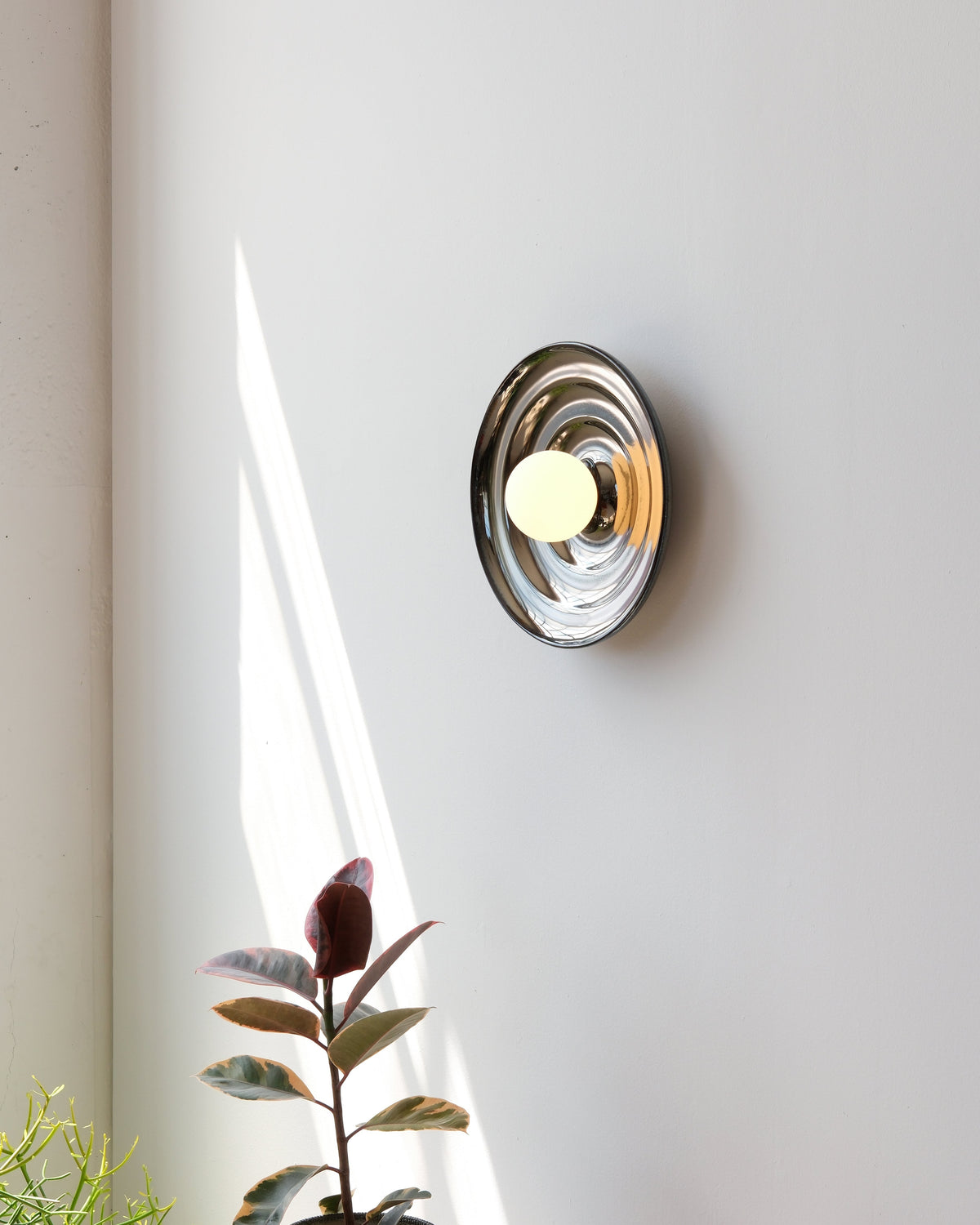 Ripple Bowl Sconce in Chrome, lit, room setting