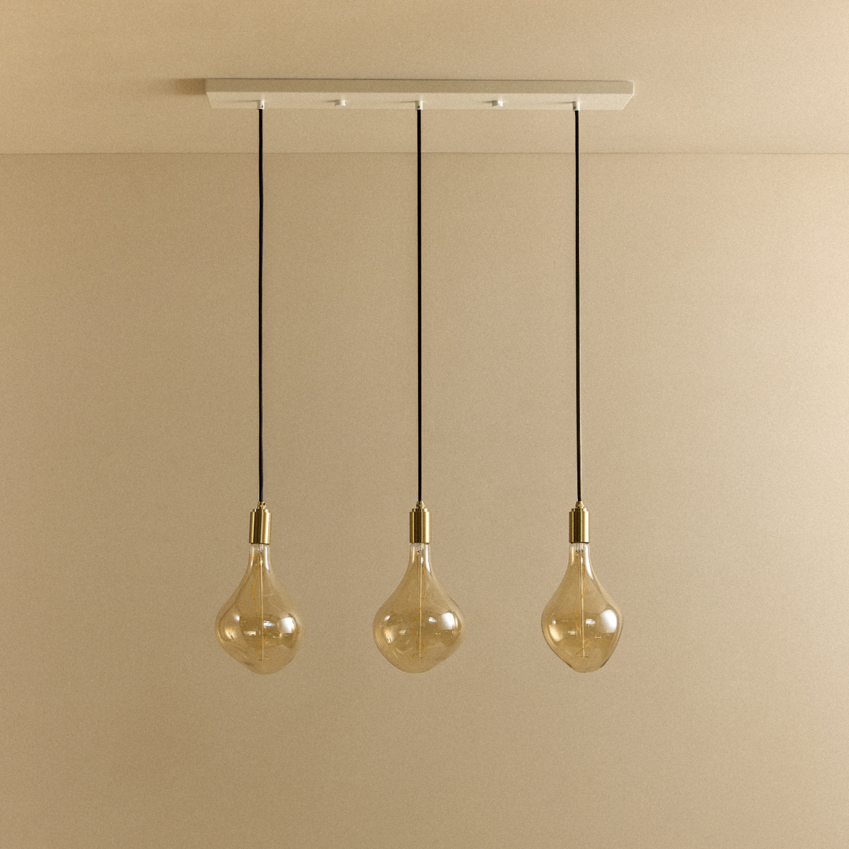 Voronoi II Linear Triple Pendant in Brass, switched off