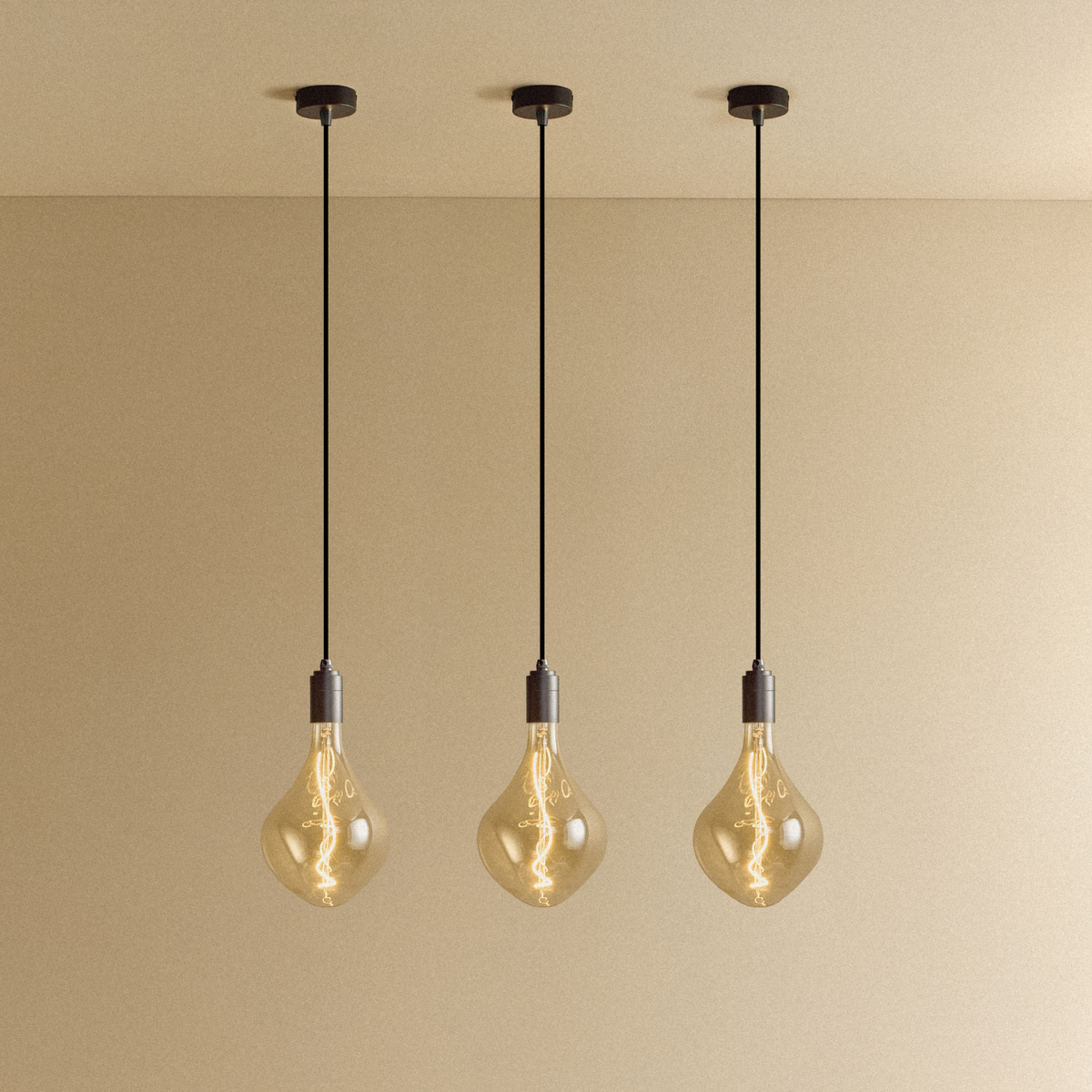 Three Voronoi II Pendant Lights in Graphite by Tala, switched on, each on its own ceiling canopy
