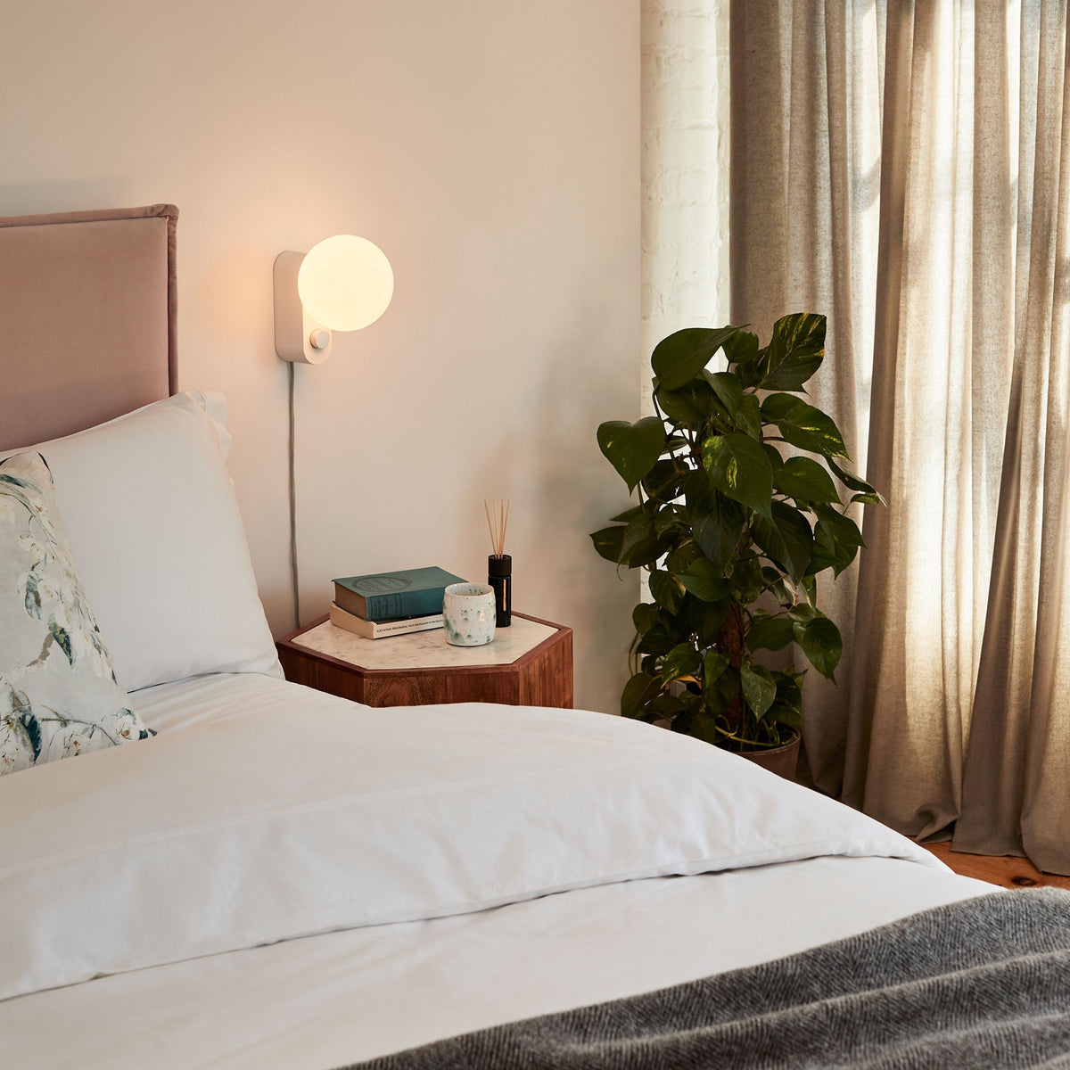 Alumina Lamp in Chalk mounted on a bedroom wall