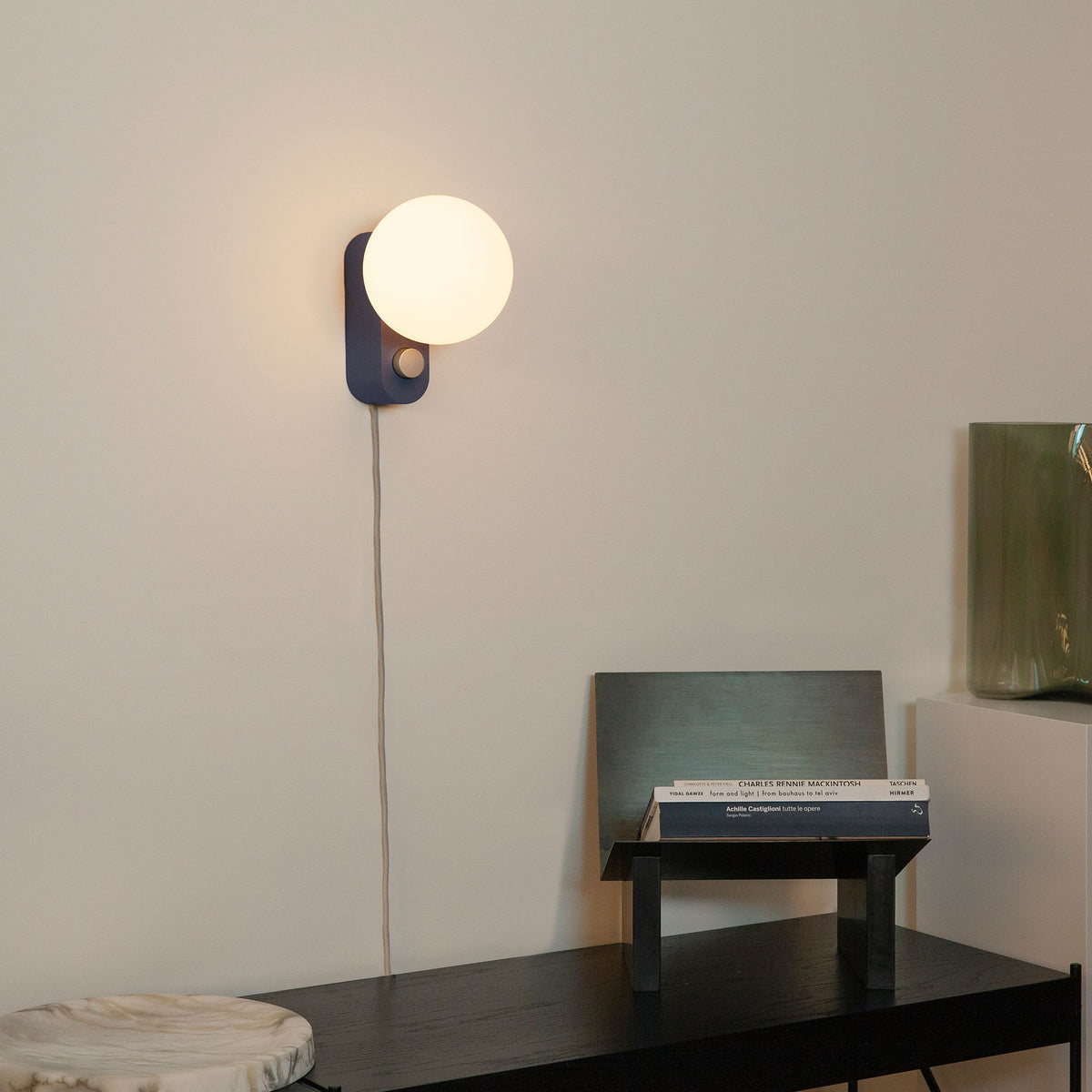 Alumina Lamp in Sapphire mounted on a hallway wall