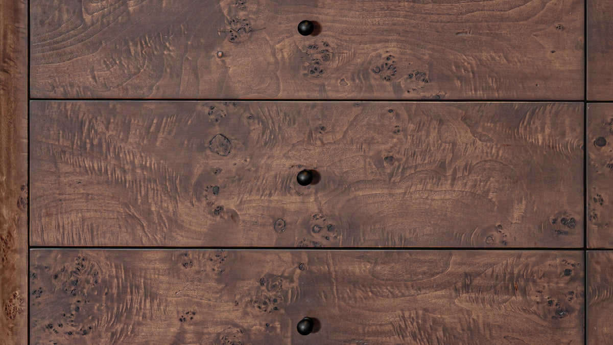 Moe's Home Collection Gibson dresser in dark brown burl in a bedroom, the burl grain across its six drawer fronts
