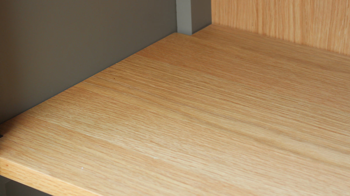 Moe's Home Collection Hannah tall cabinet, close at a shelf edge, showing the oak grain of the interior