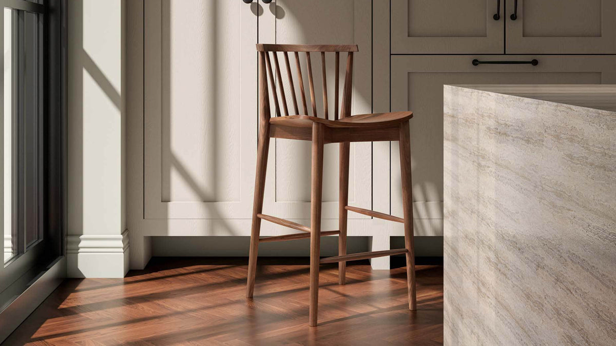 The Marley Counter Stool by Moe's Home Collection, solid walnut with a spindle back, in a room setting