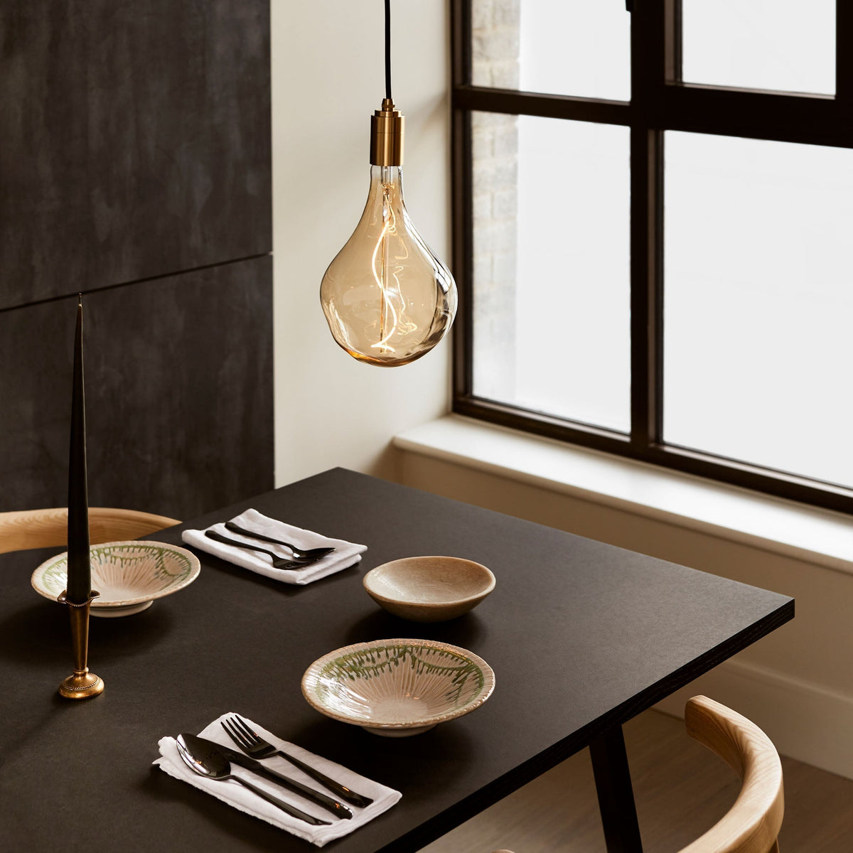 Voronoi II Pendant Light in Brass over a dining table