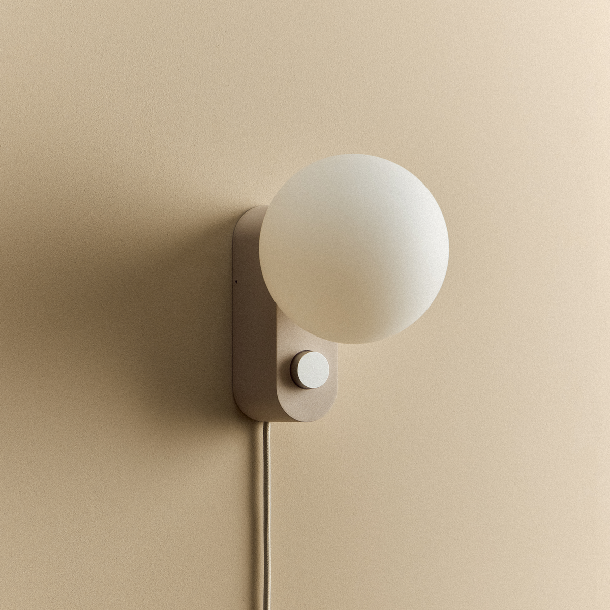 Alumina Lamp in Blossom mounted on a wall, unlit