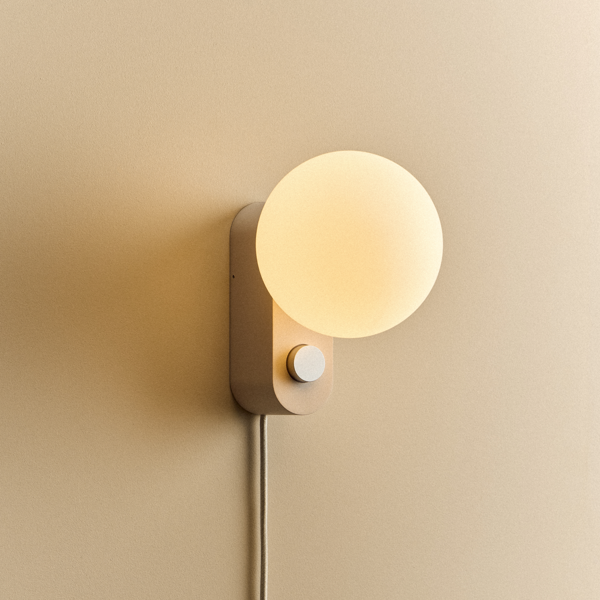 Alumina Lamp in Blossom mounted on a wall, lit