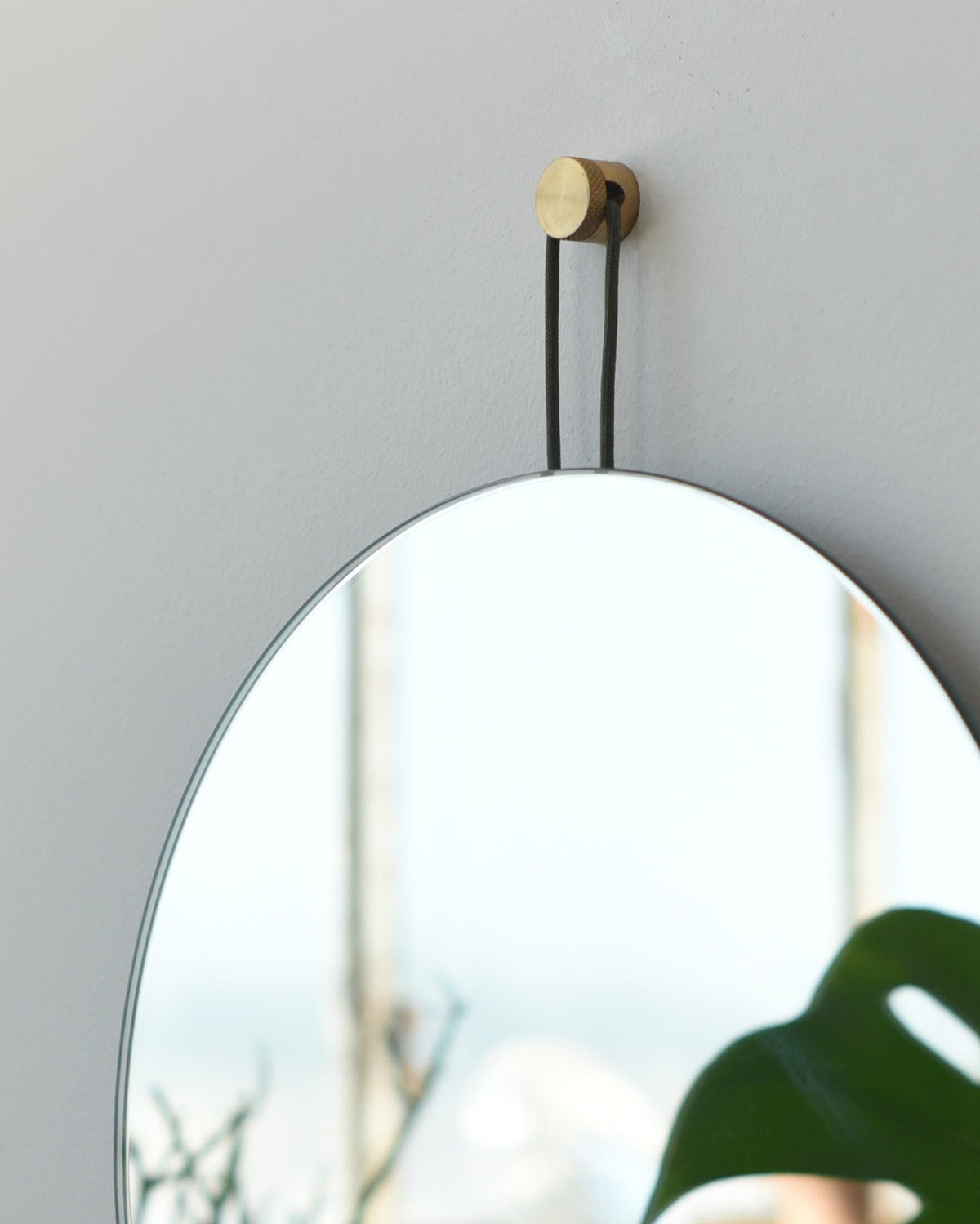 Lure Round Mirror, close up of the paracord and mounting point