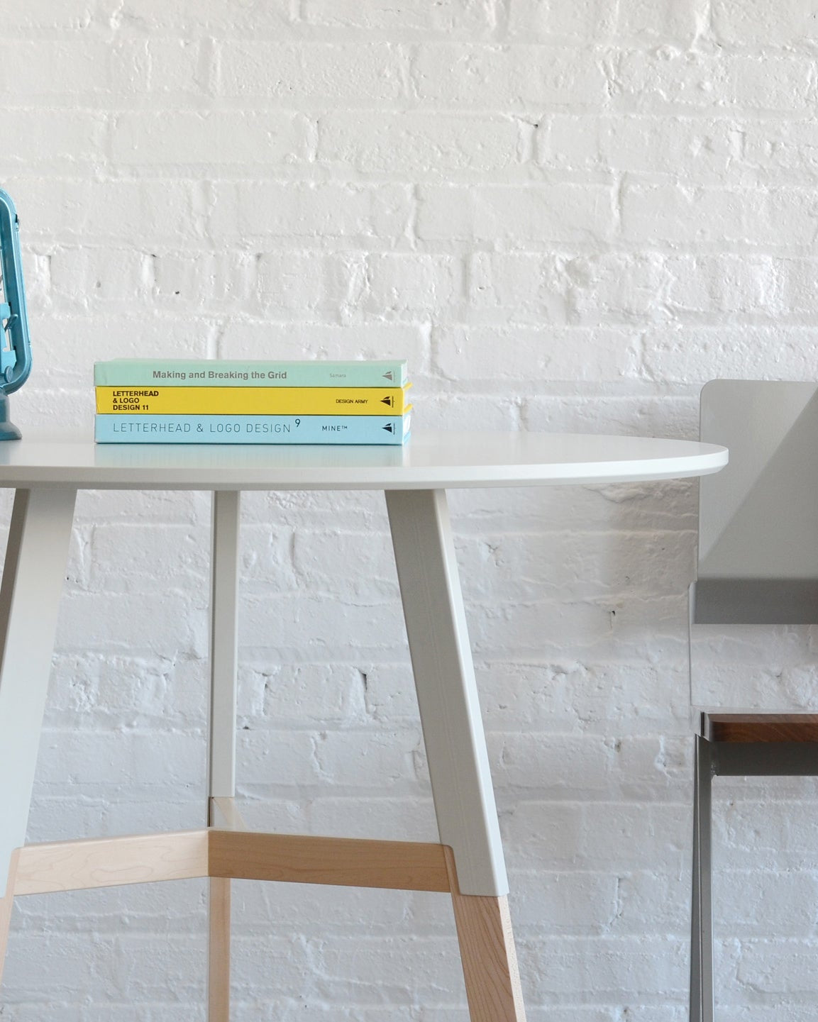 Half Nelson Café Table in Maple, room setting