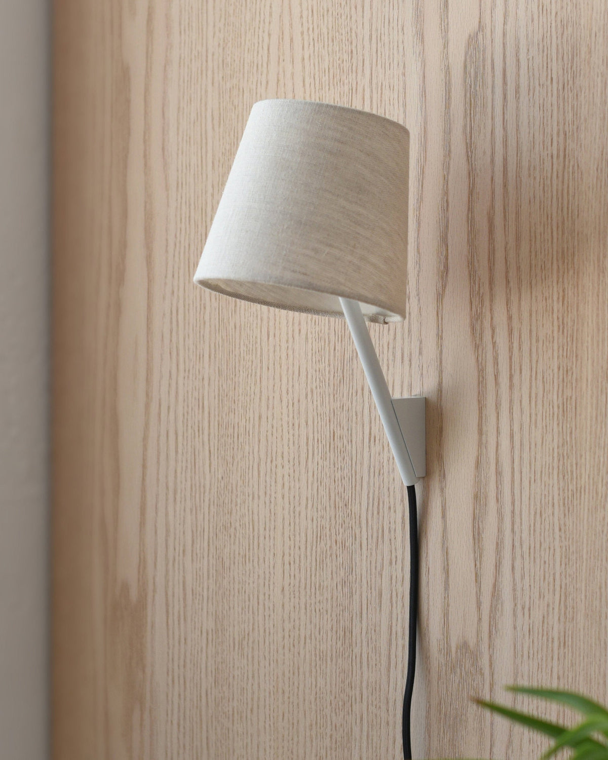 Tokyo Sconce in White on a wood wall