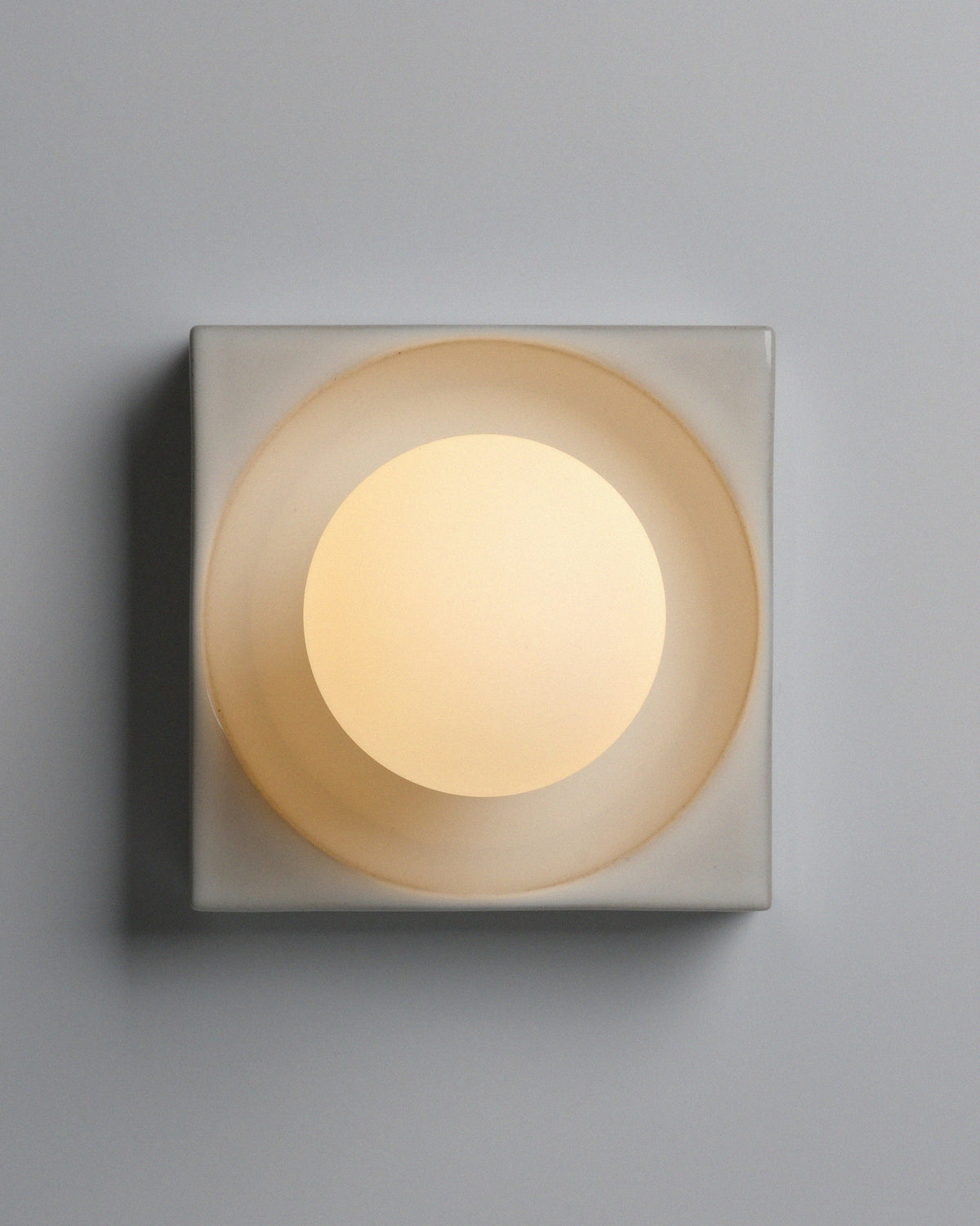 Cubic Sconce in White Glossy, lit