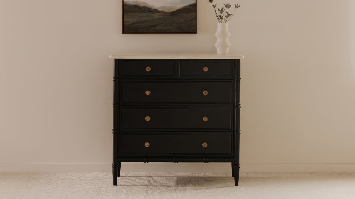 Moe's Home Collection Eleanor 5 Drawer Chest in matte black with a white marble top, standing taller than it is wide against a bedroom wall under a landscape painting