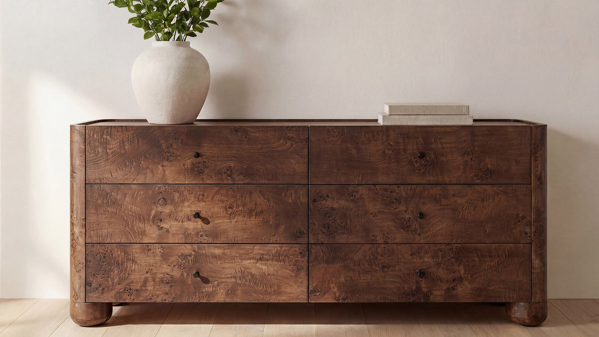 Moe's Home Collection Gibson dresser in natural oak in a bedroom, six drawers with black metal handles below the lipped top