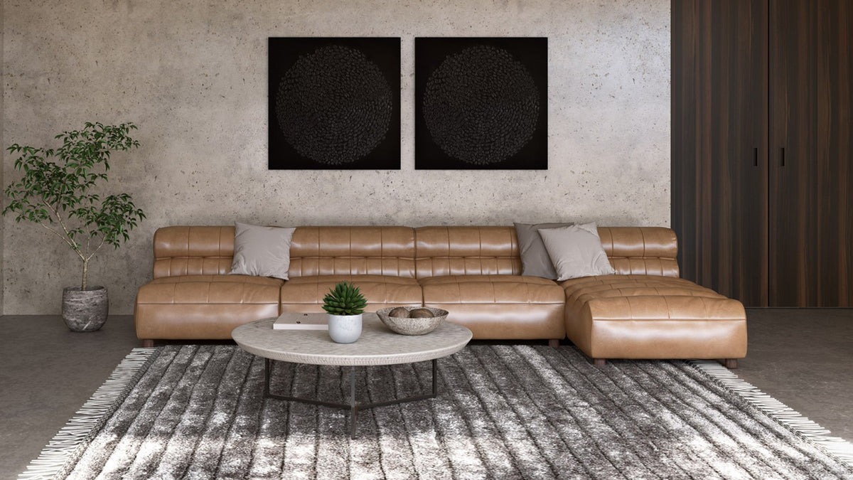Moe's Home Collection Ramsay modular sectional in tan top-grain leather, armless pieces with low channeled backs arranged in a living room