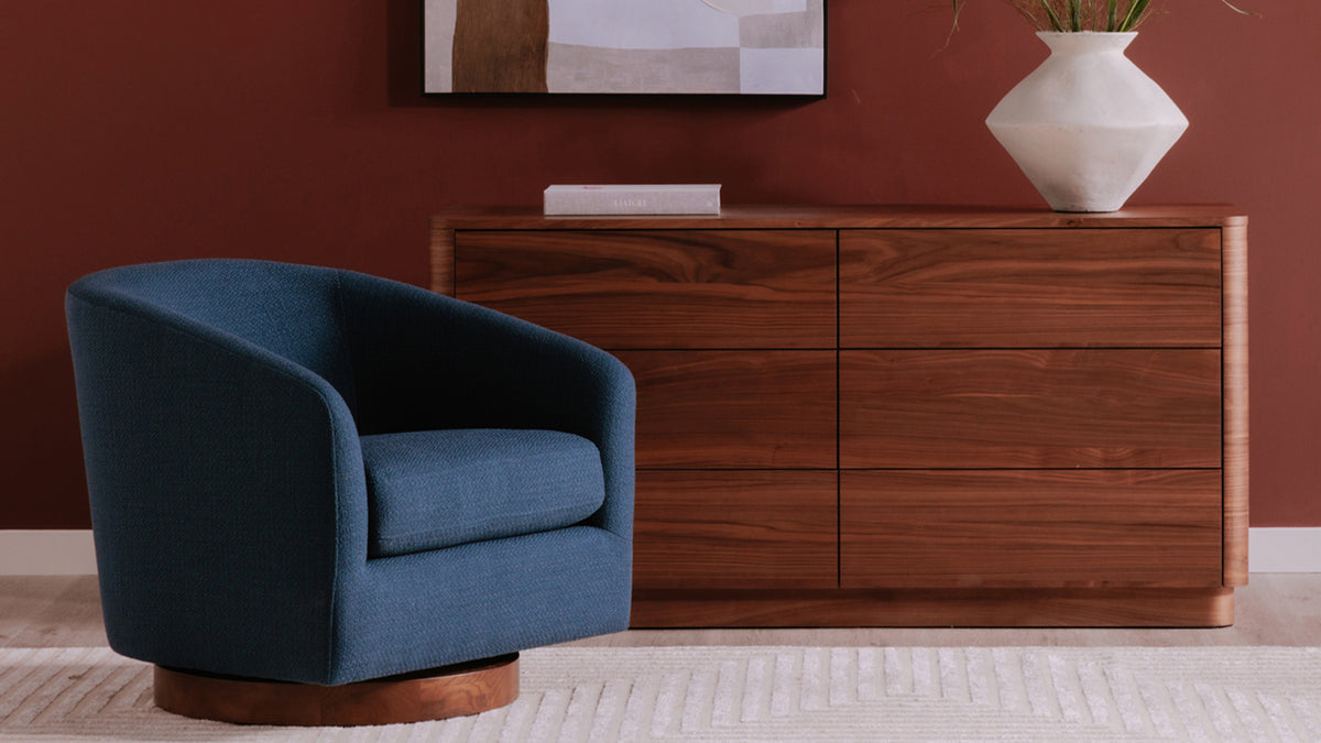 Moe's Home Collection Round Off walnut dresser in a bedroom, seen at an angle with its rounded corners and low form