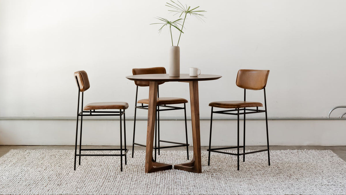 The Sailor Counter Stool by Moe's Home Collection, top grain leather on a powder-coated metal frame, in a room setting
