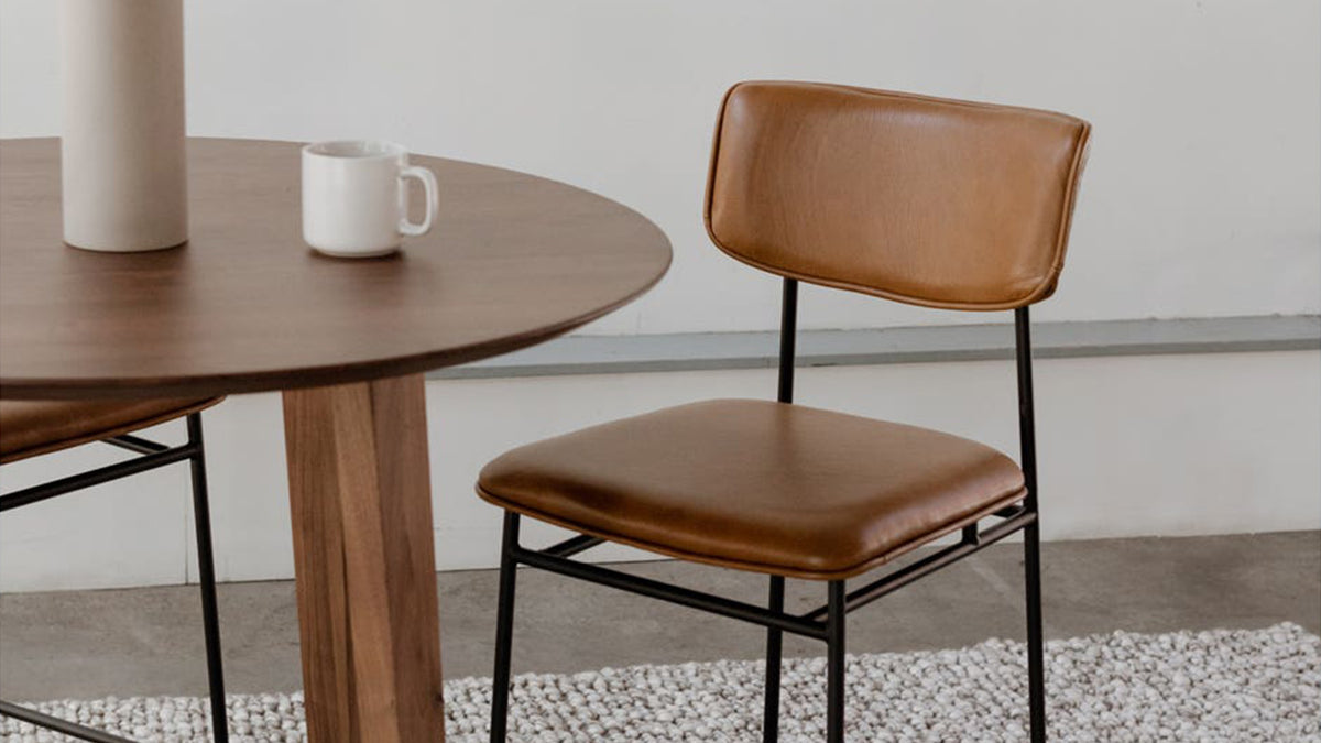 The Sailor Counter Stool by Moe's Home Collection, top grain leather on a powder-coated metal frame, in a room setting